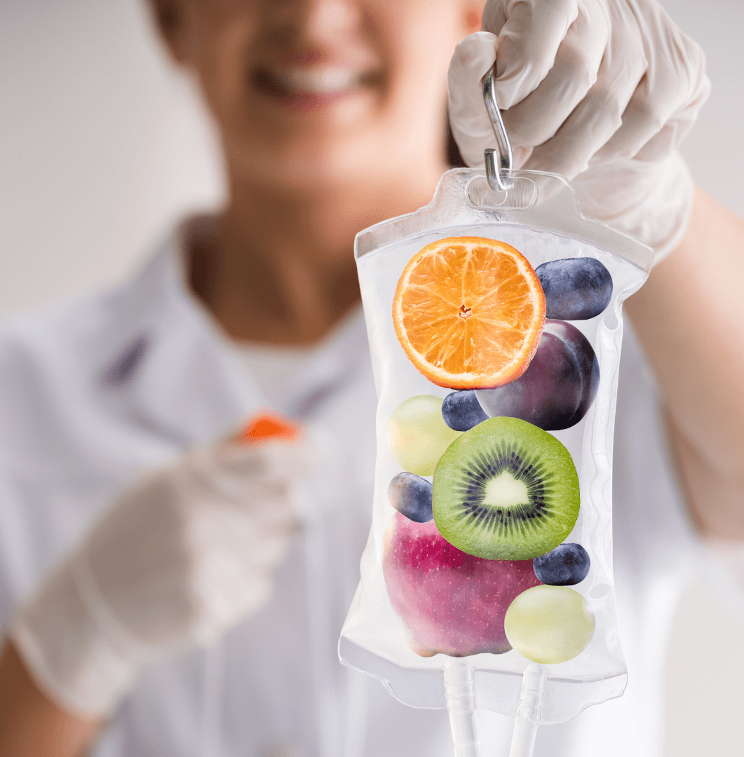 Mobile IV vitamin therapy — IV bag with fresh fruit representing nutrient-rich infusions